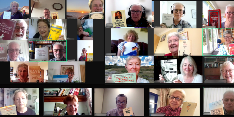 A Zoom screenshot of members on a Zoom call holding up novels they're reading with German titles